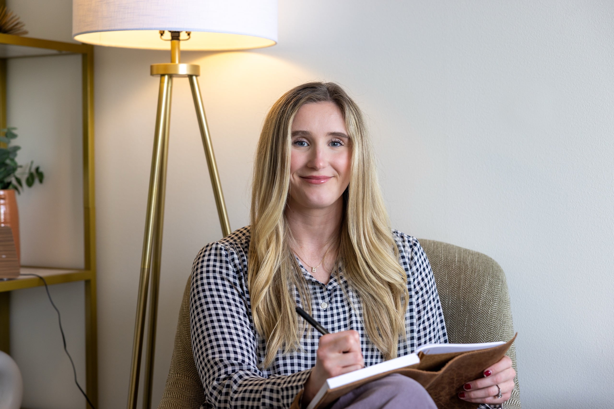 AnchorLight therapist seated with a notebook
