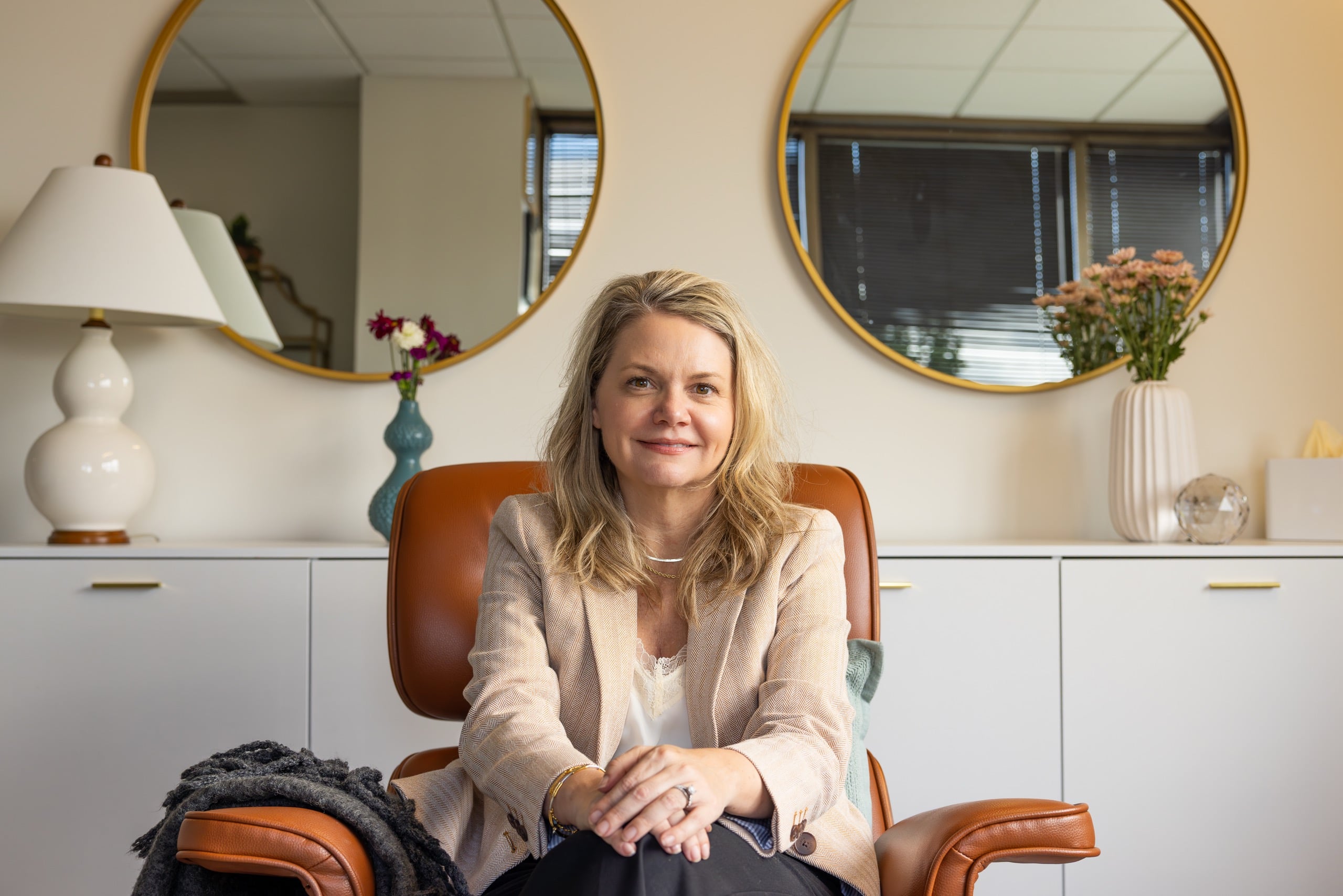 Laura Richer seated in the AnchorLight office