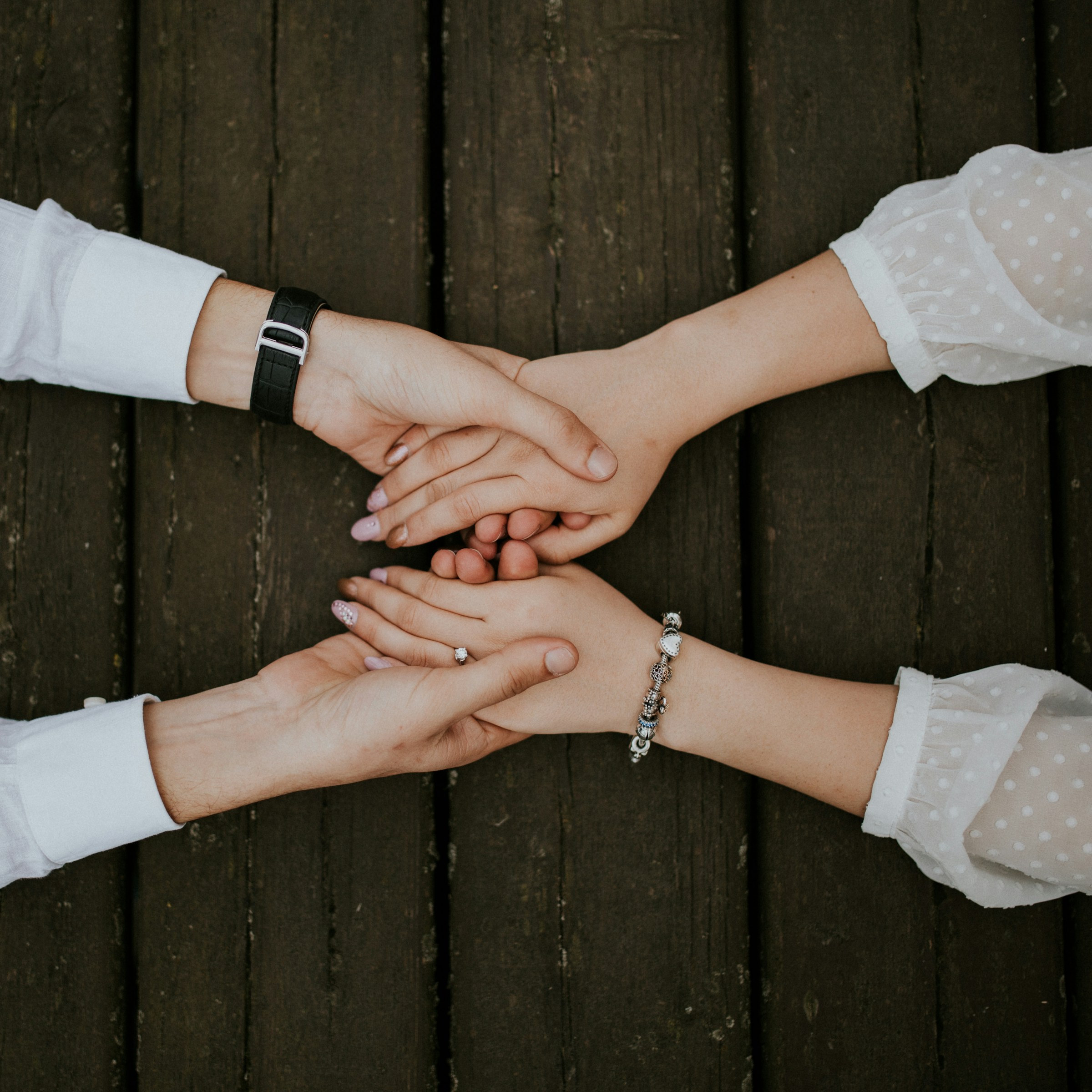 Couple holding hands during a therapy conversation