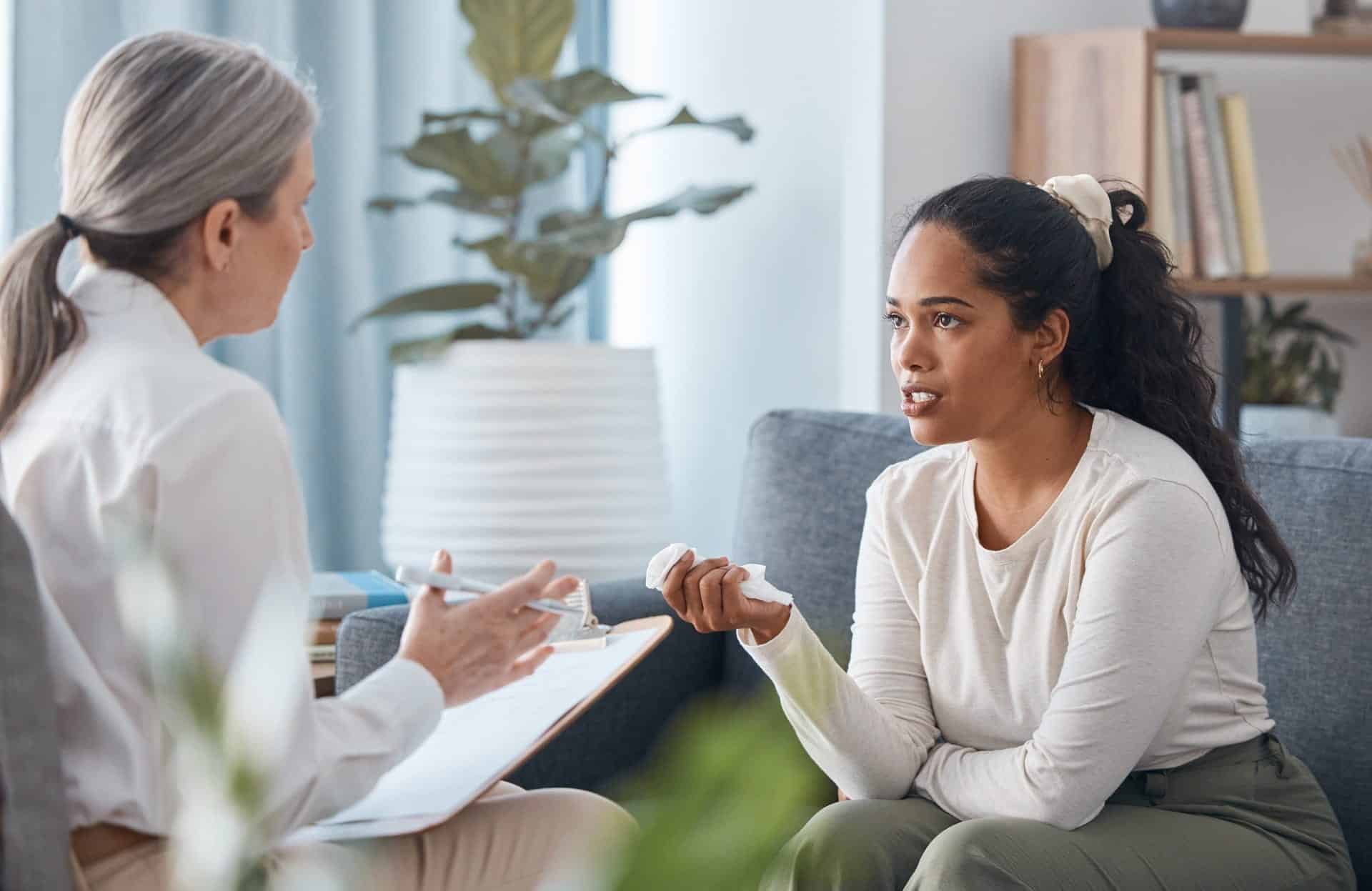 A counselor listening to a client during an individual session.
